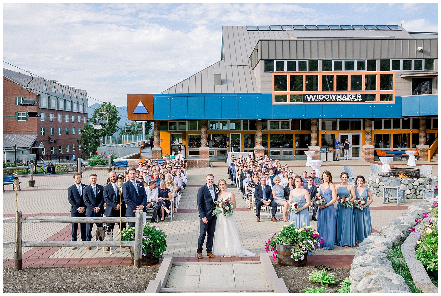 Group photo at outside wedding ceremony at Sugarloaf Mountain Resort in Maine, photos by Halie Olszowy.