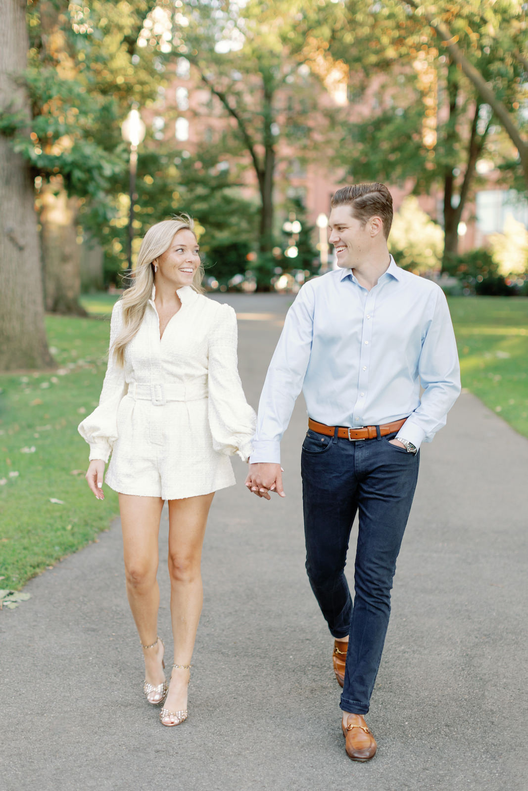 Chic couple in the Boston Public Garden looking stylish for their engagement photos