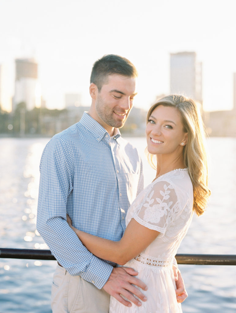 A couple in Charlestown, MA doing their engagement photos along the waterfront. He