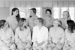 Bride and bridesmaids in robes, Coastal NH wedding at Abenaqui Country Club in Rye
