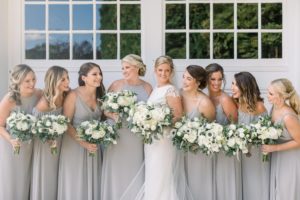 Bridesmaids in grey blue Bill Levkoff dresses from Cristina's Bridal, white bouquets with greenery, Coastal NH wedding at Abenaqui Country Club and Fuller Gardens in Rye