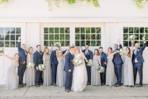 Candid wedding party photo, Navy groomsmen and gray blue bridesmaids in Bill Levkoff dresses from Cristina's Bridal, Coastal NH wedding at Abenaqui Country Club and Fuller Gardens in Rye