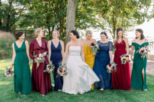 Stamford Yacht Club Wedding - CT wedding first look with classic BHLDN strapless wedding dress with jewel-tone mismatched bridesmaid dresses