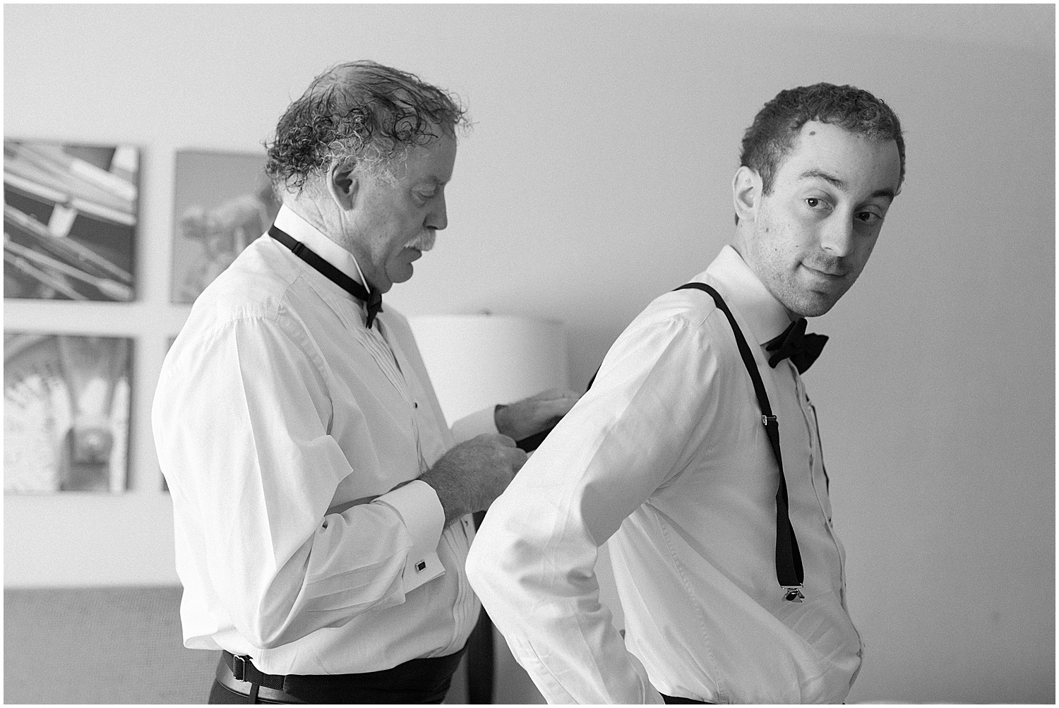 Groom's father helping him get ready