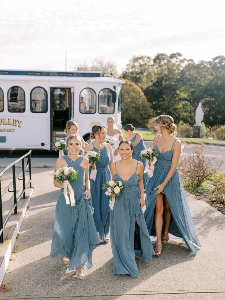 Bridesmaids walking from Trolley into church 