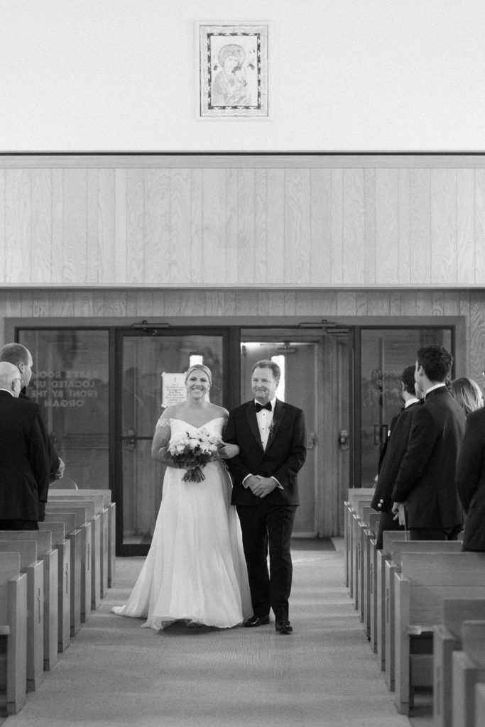 Bride walking down the aisle with her dad