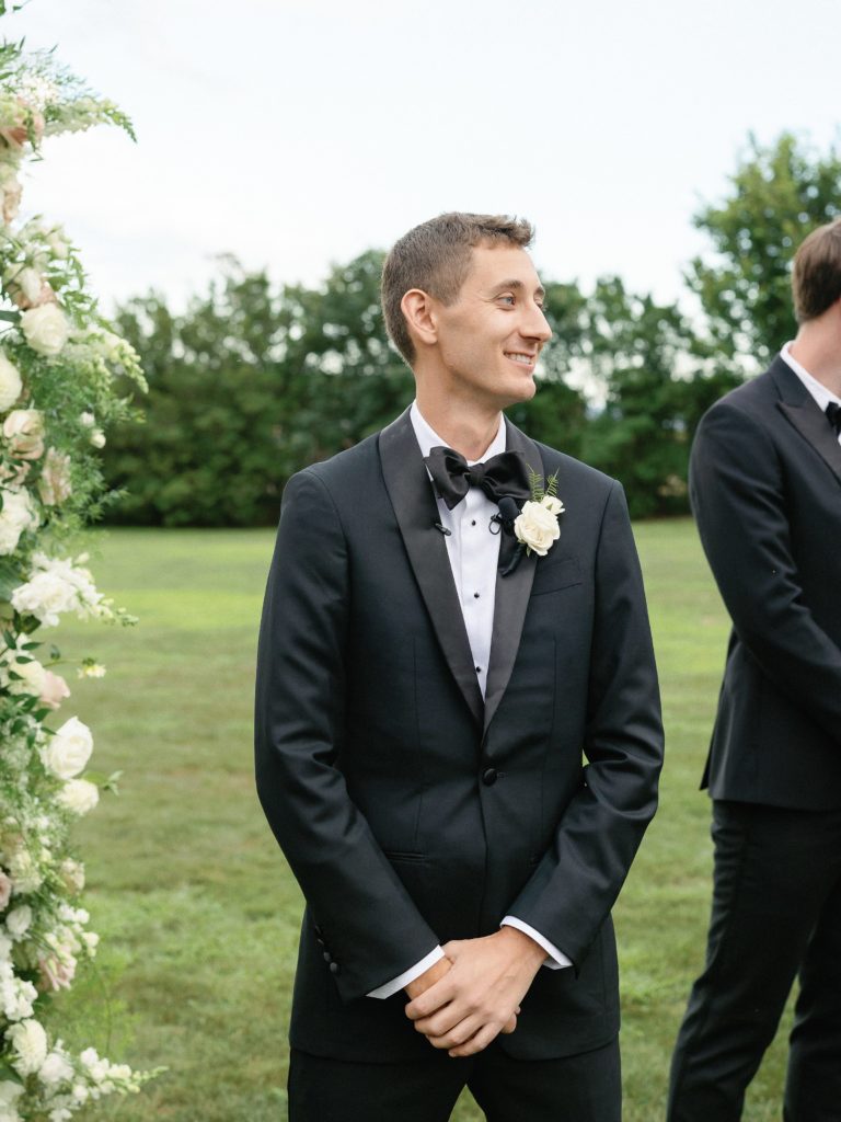 Groom's face when seeing bride walking down the aisle 