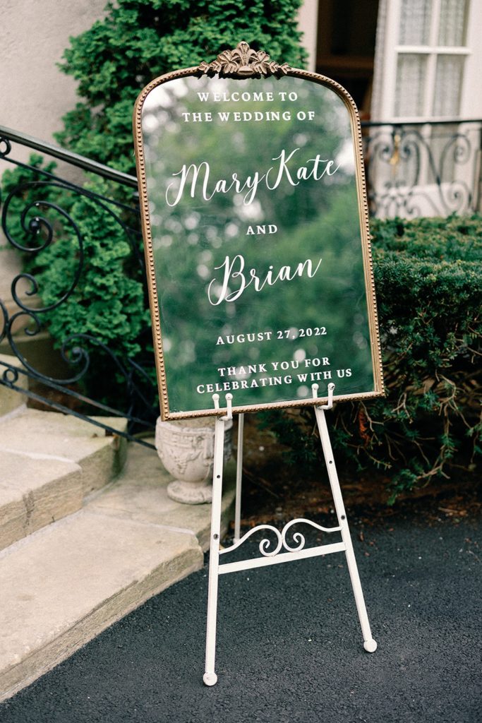 Mirror welcome sign with gold frame for Glen Man House summer wedding