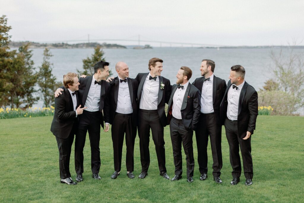 Groom and groomsmen on the lawn at Castle Hill Inn in Newport