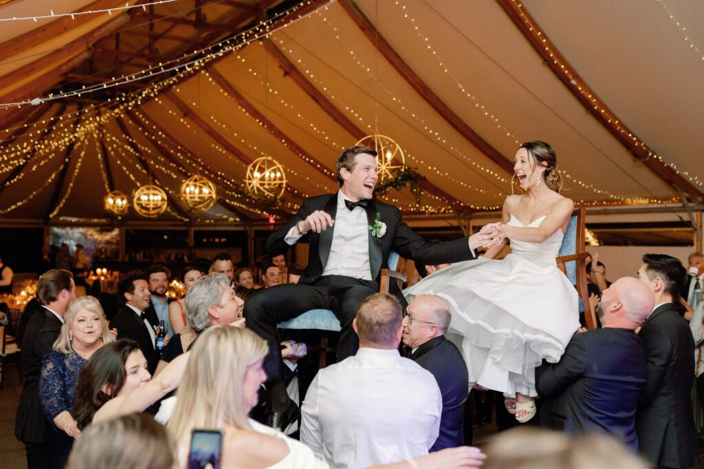 Bride and groom horah dance at reception at Castle Hill Inn