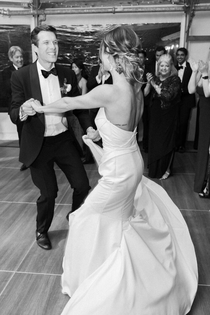Bride and groom dancing at reception at Castle Hill Inn