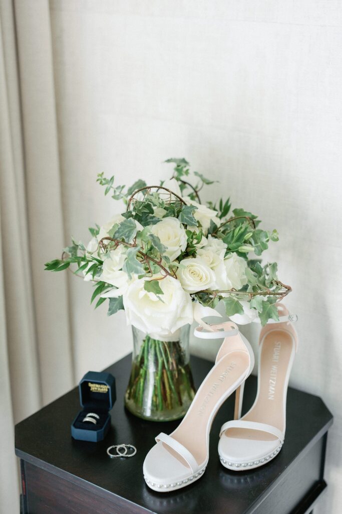 Bride getting ready details with bouquet and heels