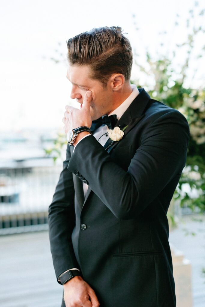 Grooms emotional reaction to bride walking down the aisle 