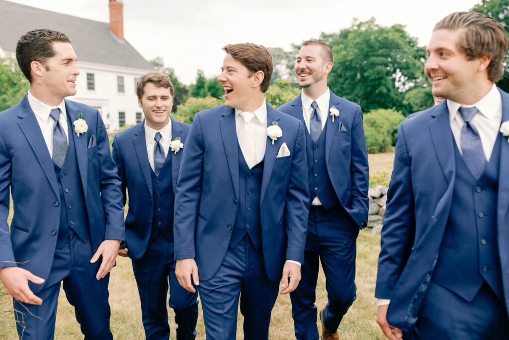 Groom and groomsmen candid photo for summer New England wedding