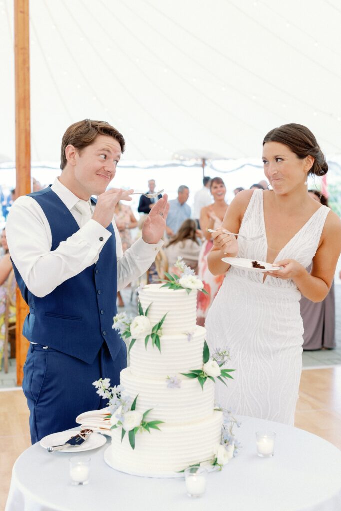 Bride and groom cake cutting for Coastal New England Tented Wedding