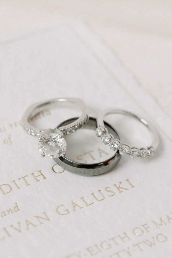 Newport Mansion flat-lay wedding bands and engagement ring detail photography