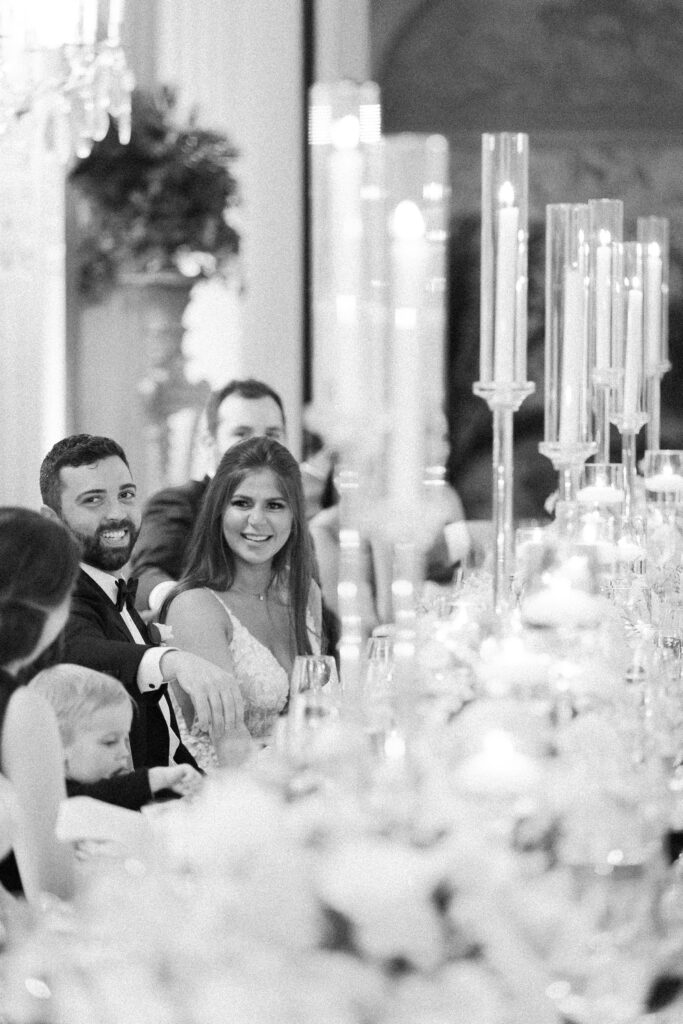 Bride and groom candid black and white photo during wedding reception 