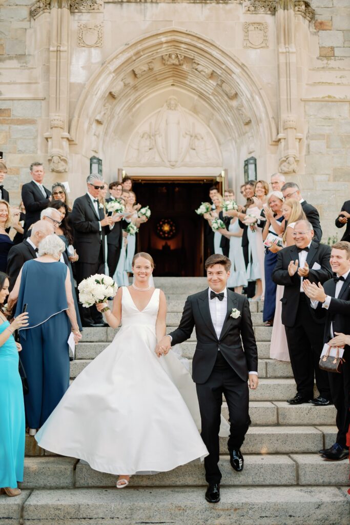 Bride and groom exit at Saint Ignatius in Boston