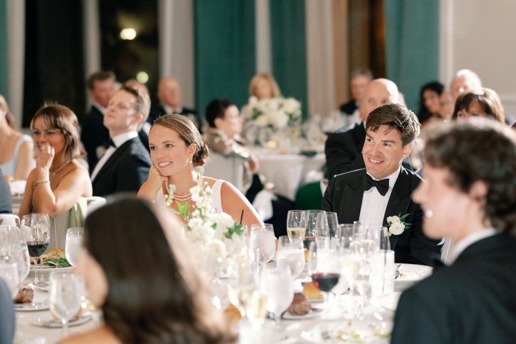 Bride and groom reaction during speeches at the Newbury Hotel in Boston