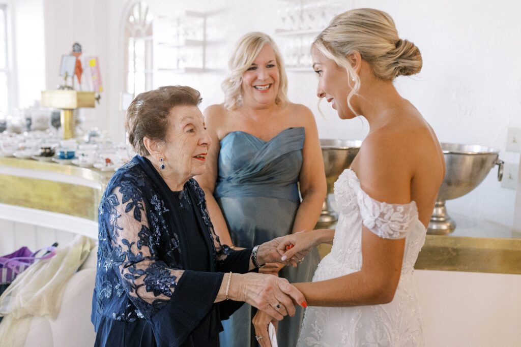 Bride and grandmother candid photo while getting ready at Garrison Inn