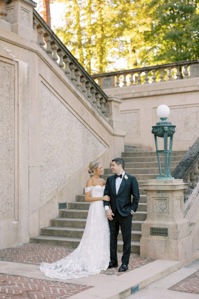 Bride and groom portrait on the steps at Crane Estate in Ipswich 