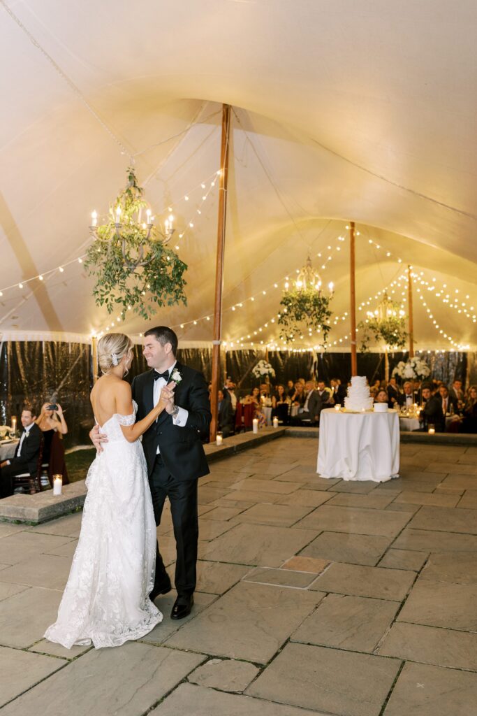 Bride and groom first dance under tent for fall New England wedding