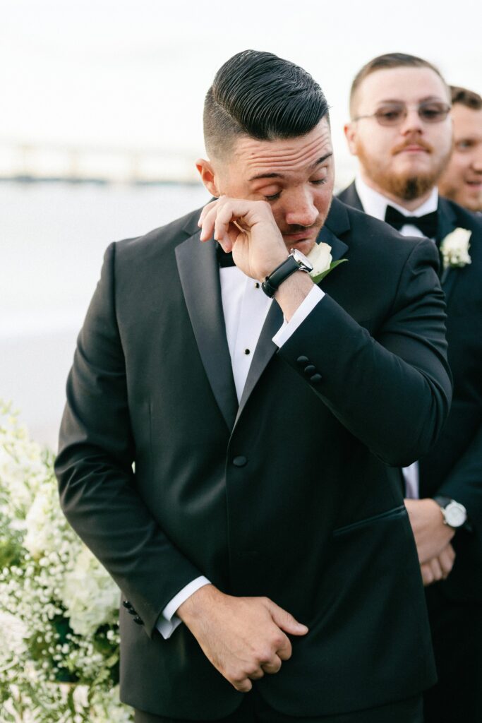 Grooms reaction to seeing bride walk down the aisle during Newport wedding