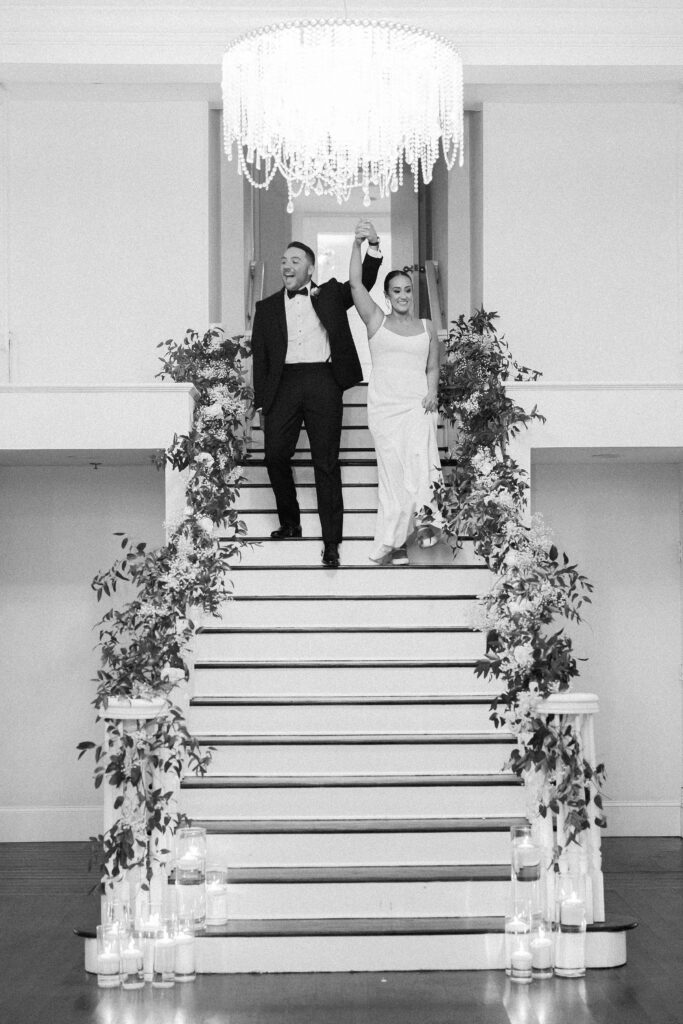 Bride and groom entering their reception for Belle Mer wedding