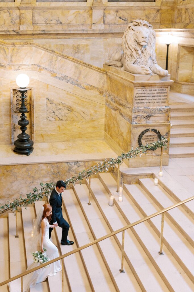 Bride and groom portrait on the iconic stairs of the Boston Public Library
