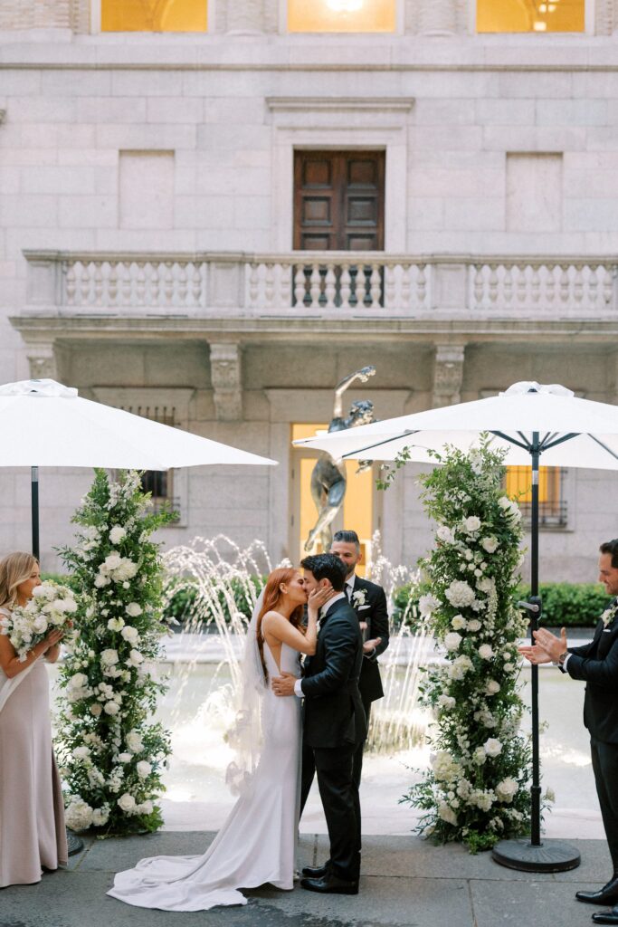 Unique Boston wedding ceremony at the Boston Public Library with the fountain in the background