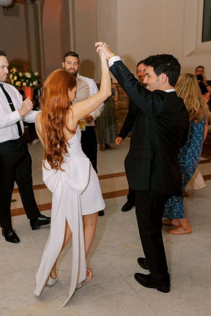 Bride and groom dancing during reception 