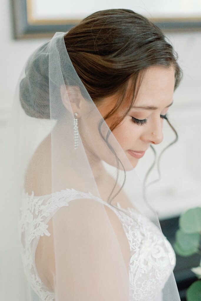 Bridal portrait of veil and earrings for Boston city wedding