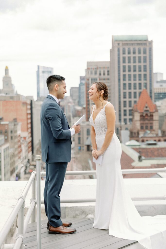 Bride and groom exchanging private vows during first look on the rooftop of The Lenox Hotel in Boston