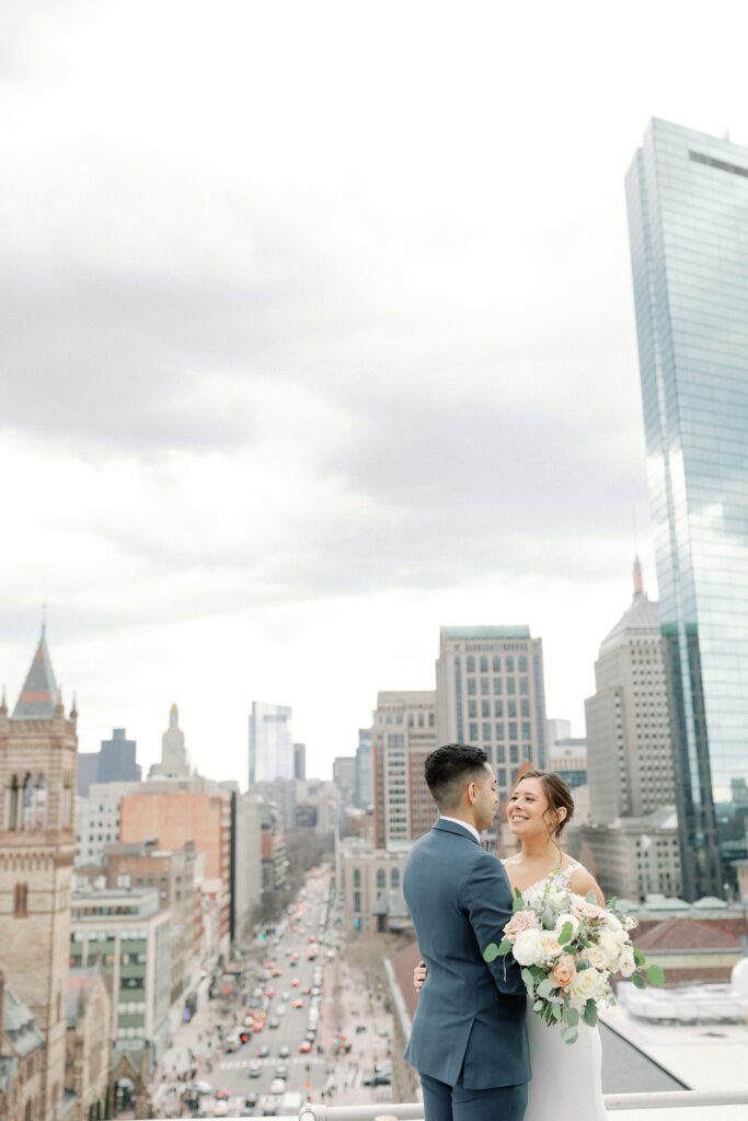 Bride and groom first look on the rooftop of The Lenox Hotel in Boston