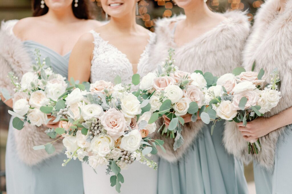 Bridesmaids fur wrap and bouquets for Boston winter wedding at The Lenox Hotel