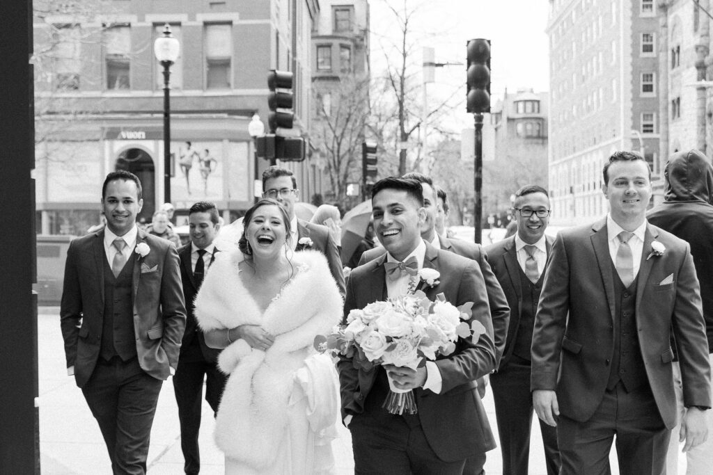 Wedding party candid photo while walking on the streets of Boston