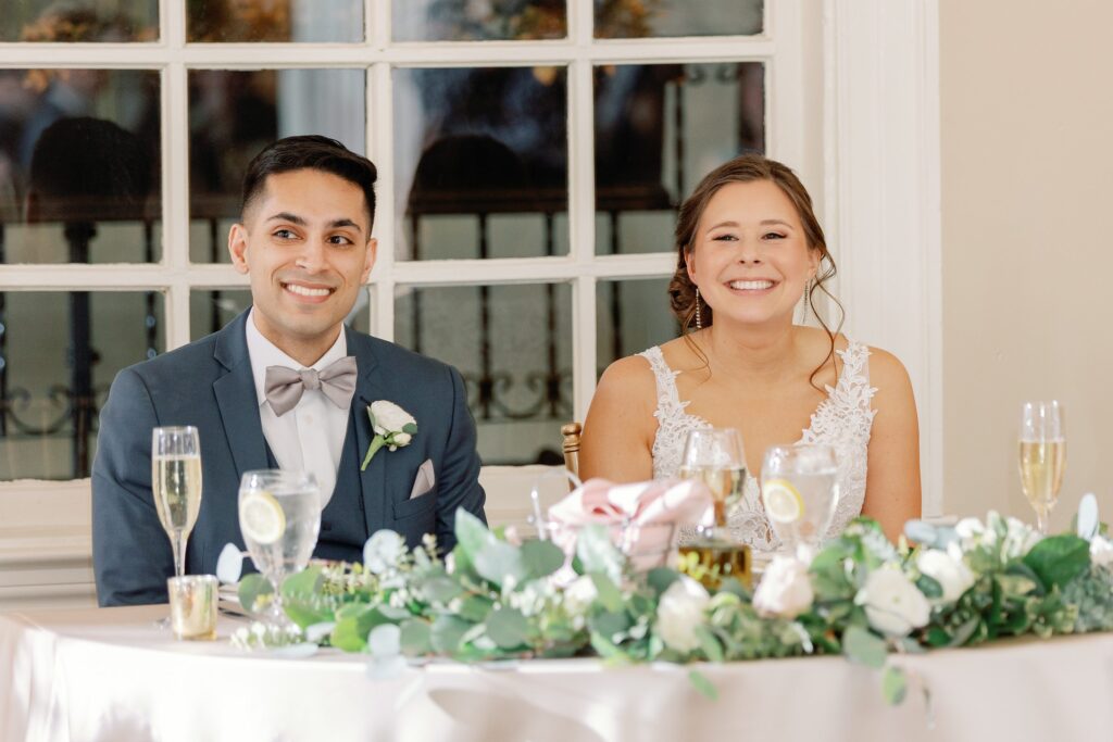 Bride and groom faces during toasts 