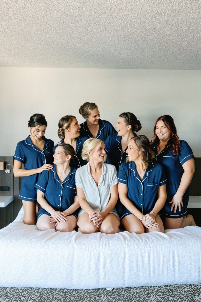 Bride and bridesmaids wearing matching PJs for golf club wedding