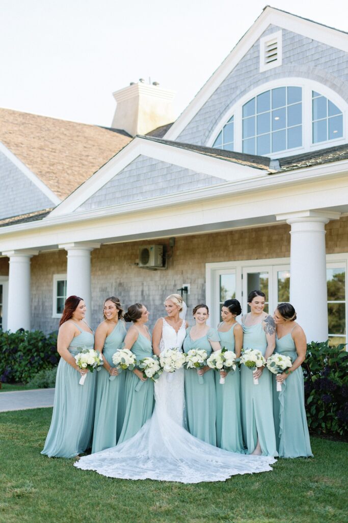Bride and bridesmaids wearing seafoam green dresses for summer wedding