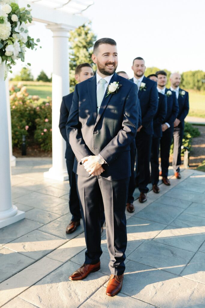 Groom's reaction to seeing bride walk down the aisle at Waverly Oaks Golf Club