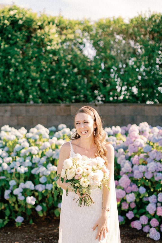 Bridal portrait at the Wychmere Beach Club on Cape Cod with hydrangeas in the background 