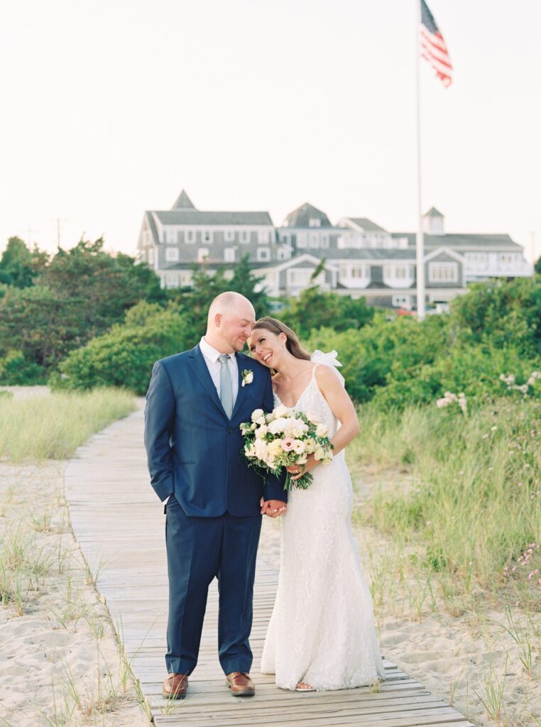 Sunset portraits at the Wychmere Beach Club during summer wedding on Cape Cod