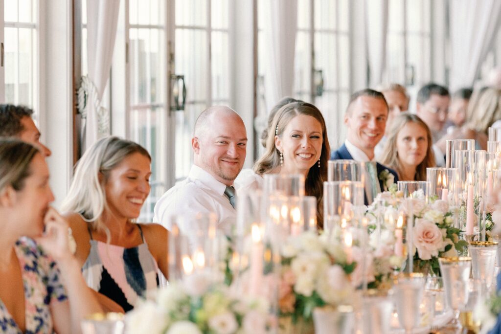 Wedding guests sitting at tables during wedding reception
