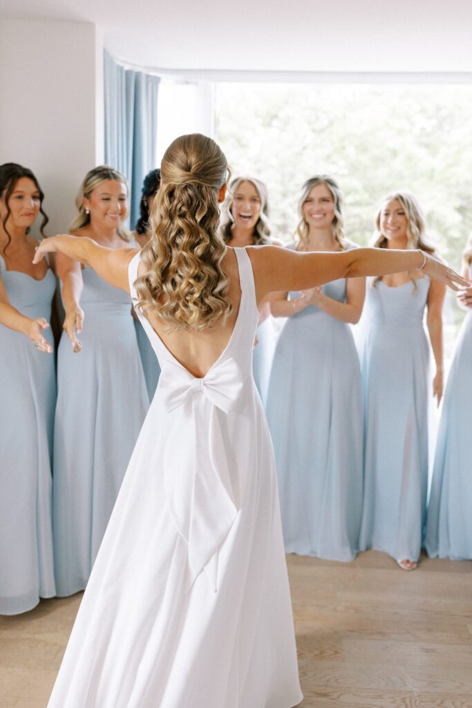 Bride and bridesmaids dress reveal before Back Bay wedding 