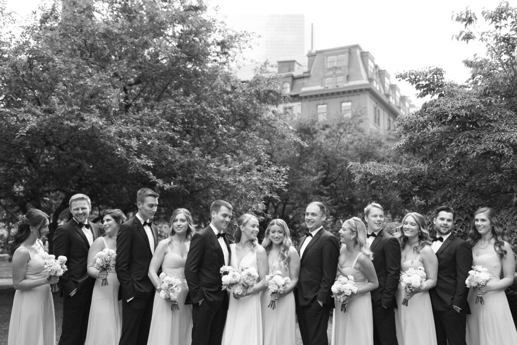 Black and white wedding party portrait in Boston Public Garden