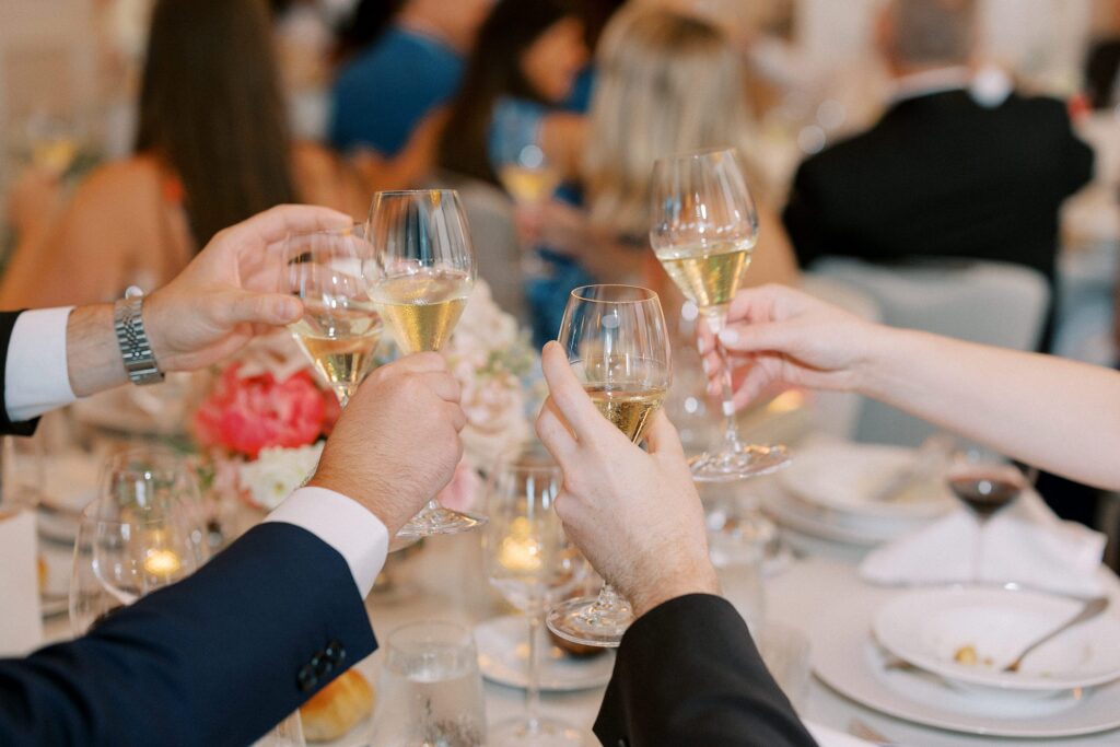 Cheers during toast during wedding reception at The Newbury Boston