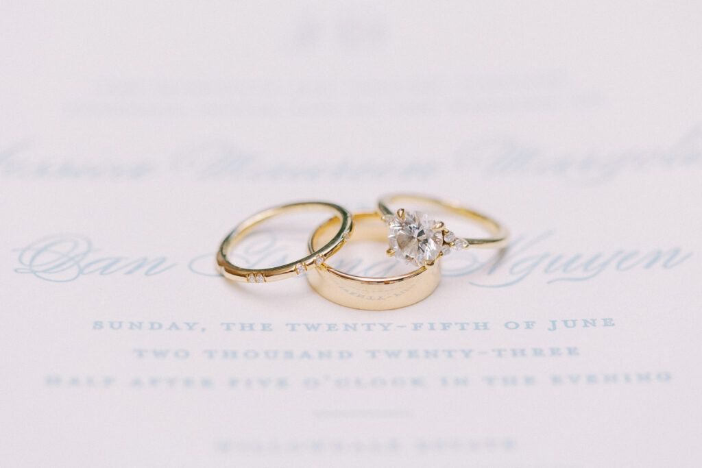 Wedding bands and engagement ring detail photography
