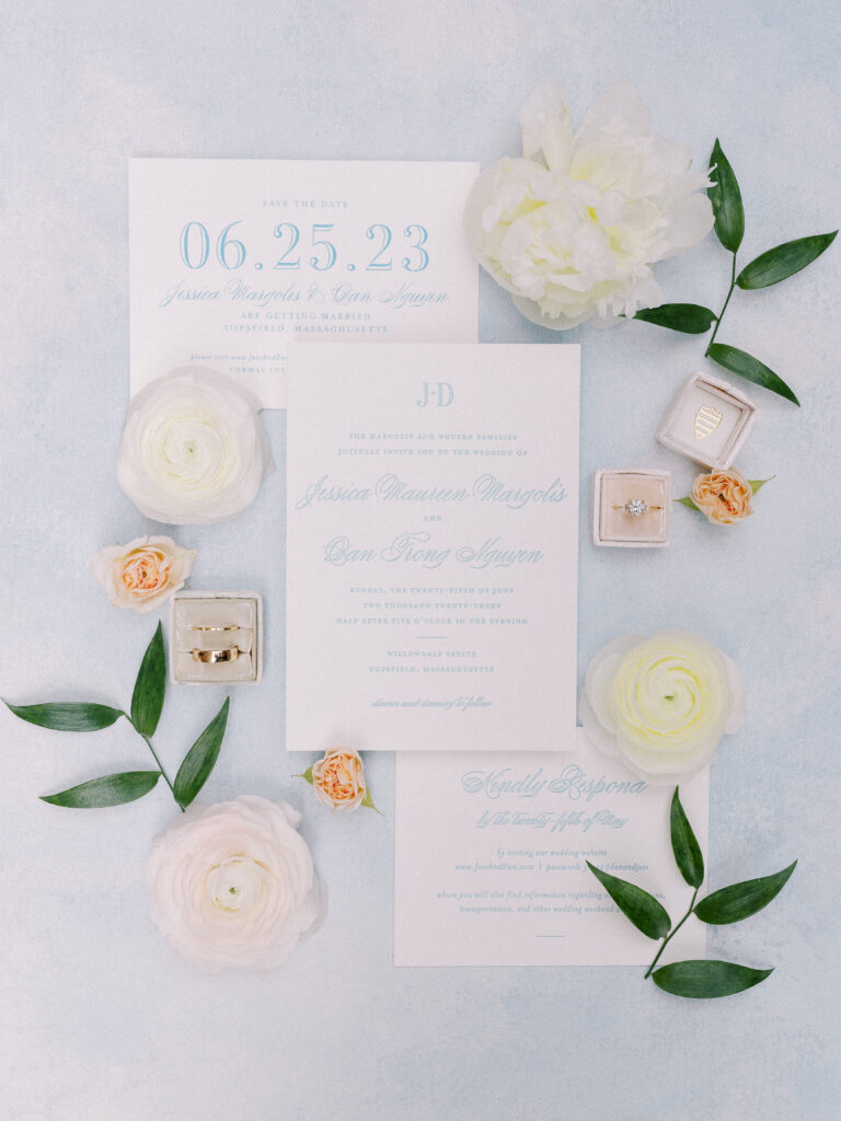 Invitation flat lay with rings for summer wedding at the Willowdale Estate