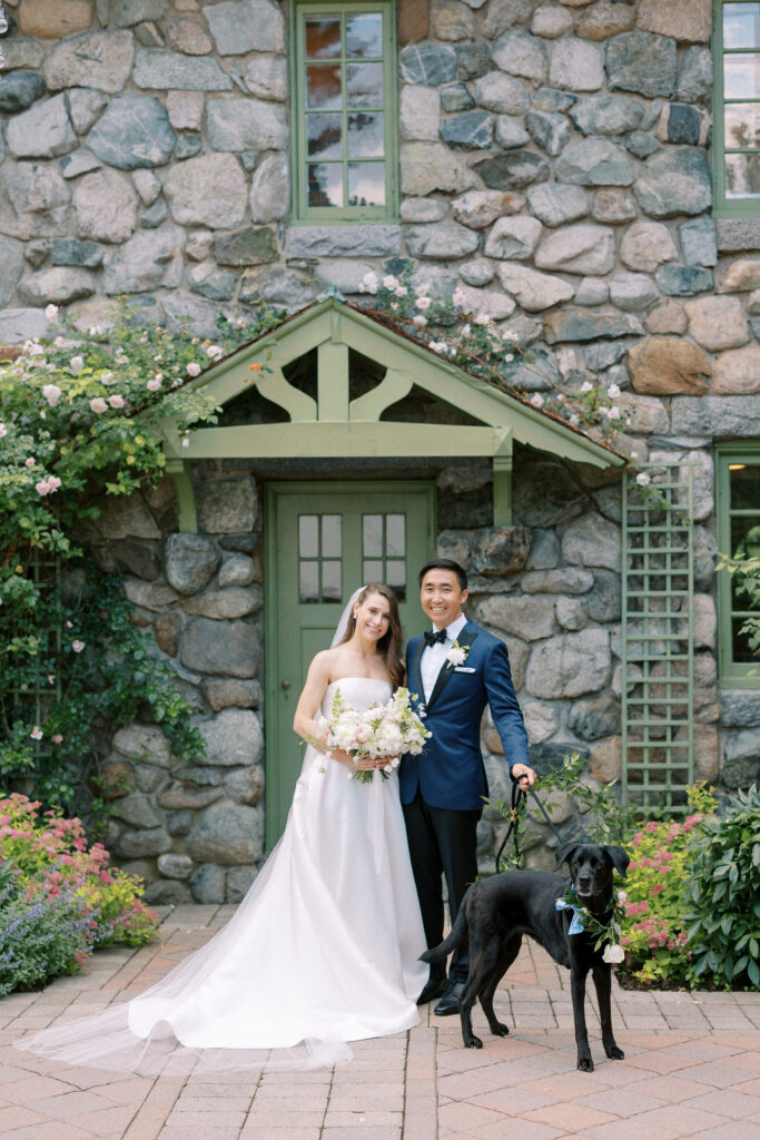 Bride and groom photo with black lab dog before Willowdale Estate wedding