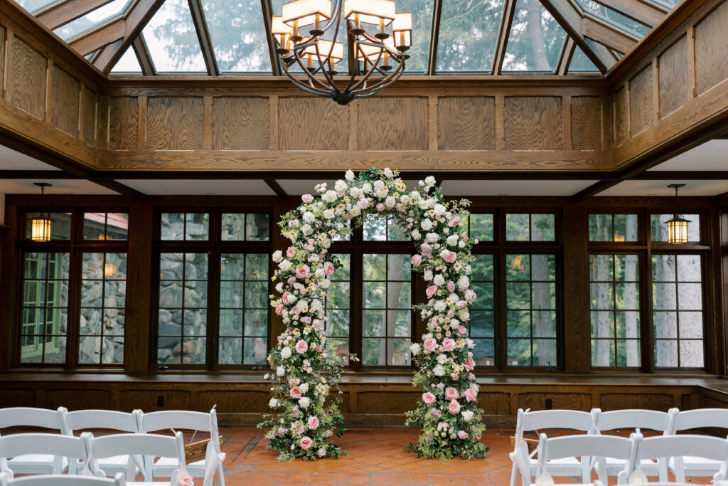 Pink and white wedding arbor at Willowdale Estate